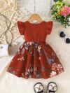 Adorable girl wearing a vibrant Summer Bloom floral print dress perfect for summer The dress features a playful colorful floral pattern