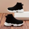Stylish and comfortable Newness Cloudwalkers Kids High Tops in action perfect for active play A childs feet are shown wearing the high top sneakers while engaged in energetic activity