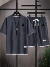 Model wearing the Newness Dubai Nights Mens Casual Sports Set a comfortable and stylish navy blue polyester athletic set perfect for lounging or working out
