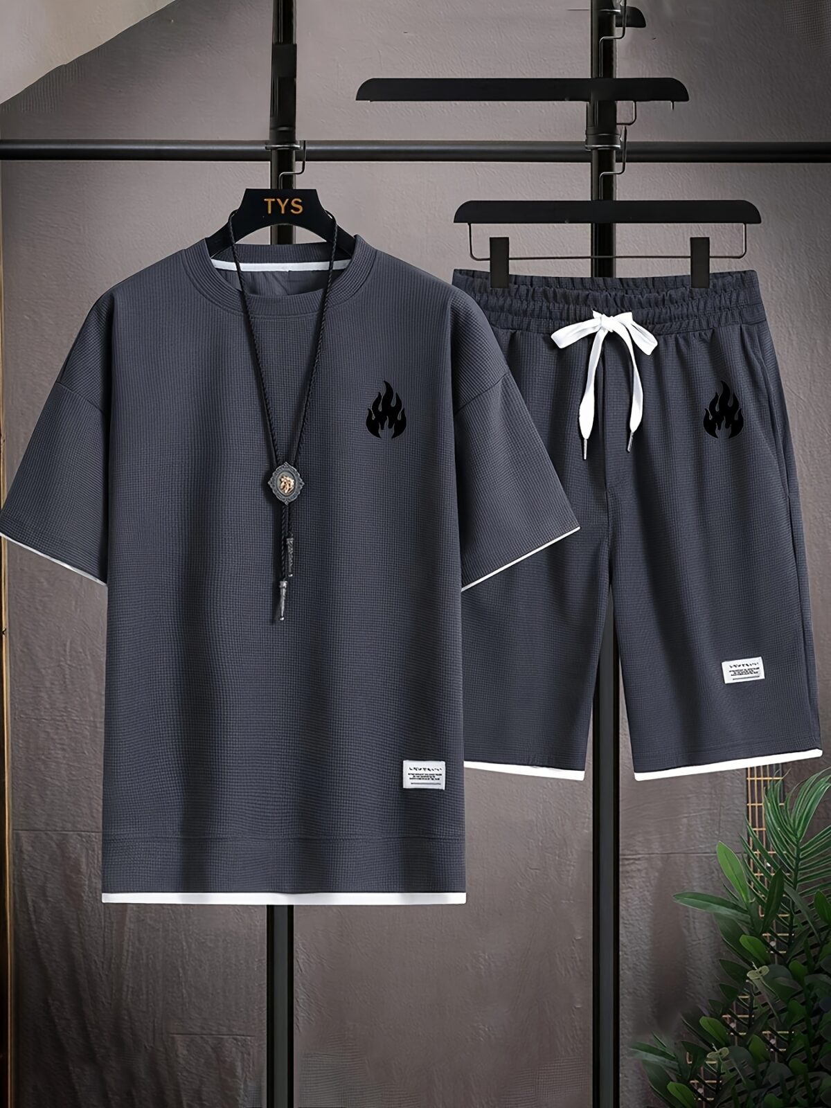 Model wearing the Newness Dubai Nights Mens Casual Sports Set a comfortable and stylish navy blue polyester athletic set perfect for lounging or working out