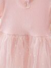 Adorable little girl twirling in a pink Summer Bloom Rose Princess Dress from Newness showcasing its comfortable and stylish design