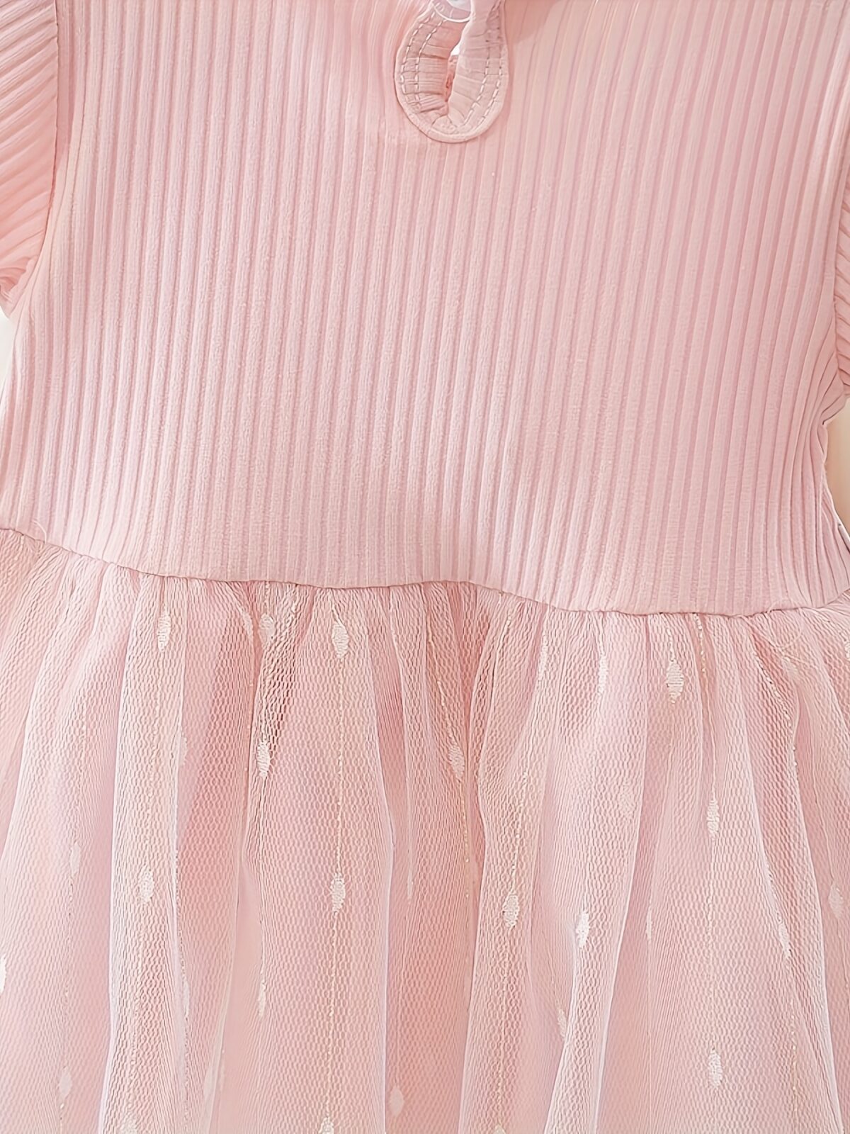 Adorable little girl twirling in a pink Summer Bloom Rose Princess Dress from Newness showcasing its comfortable and stylish design