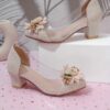 Adorable little girl wearing Newness Enchanted Garden Girls Block Heels showcasing the charming design and comfortable block heel