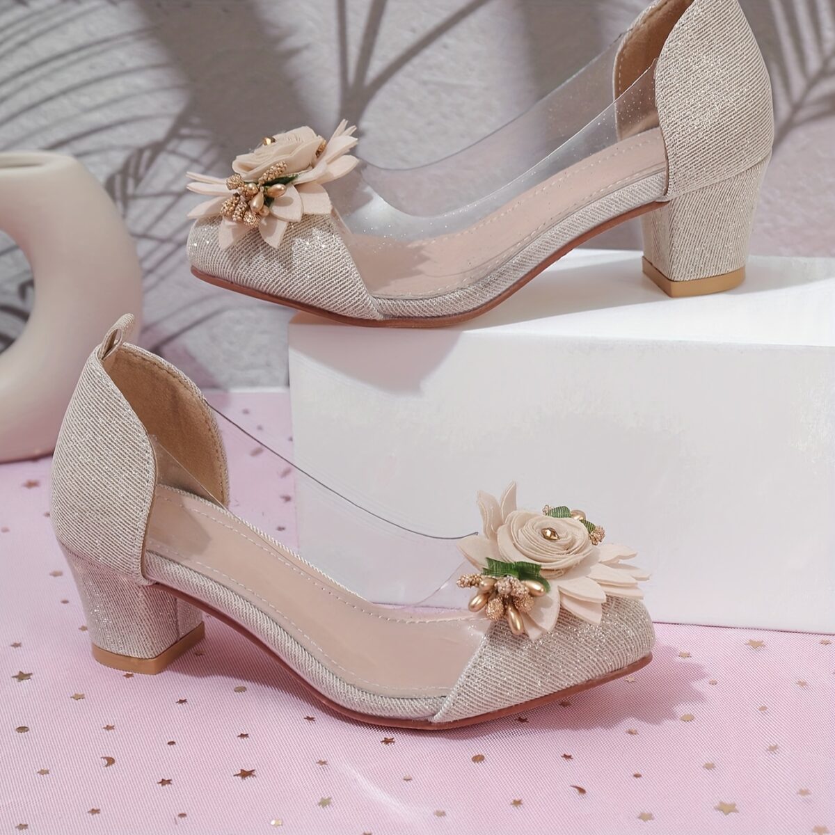 Adorable little girl wearing Newness Enchanted Garden Girls Block Heels showcasing the charming design and comfortable block heel
