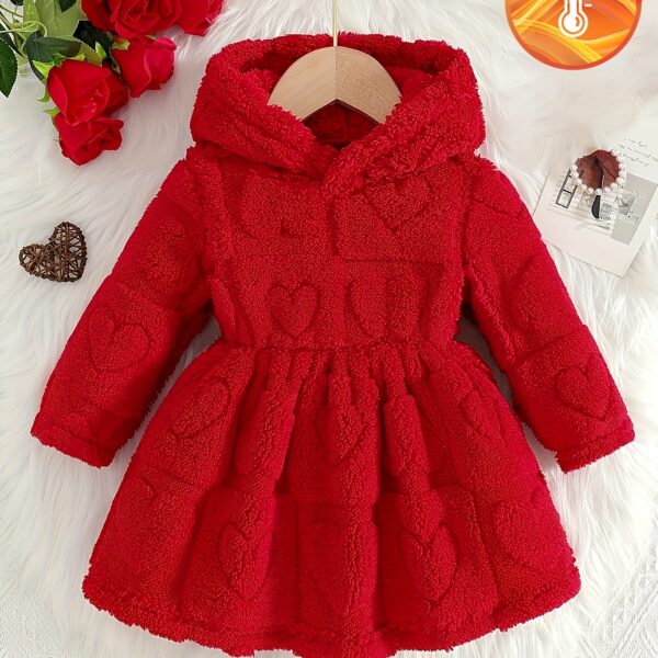 Baby girl wearing an adorable red heart patterned dress Perfect for Fall and Winter