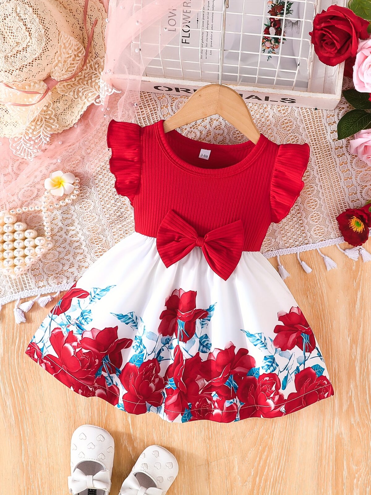 A little girl wearing a charming summer floral print dress