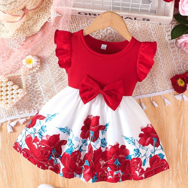 A little girl wearing a charming summer floral print dress