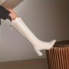 Newnesss Elevated Beige Knee High Boots Elegant beige leather boots that extend to the knee perfect for any occasion