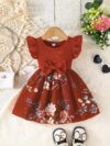 Adorable girl wearing a vibrant Summer Bloom floral print dress perfect for summer The dress features a playful colorful floral pattern