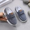 Stylish and comfortable blue canvas shoes for boys perfect for everyday wear The shoes feature a classic design with a touch of modern style