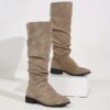 Newness Slouchy Suede Mid Calf Boots in rich brown suede leather showcasing the comfortable slouchy fit and mid calf height Perfect for adding a touch of effortless chic to any winter outfit