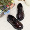 Adorable baby boy wearing stylish and comfortable Newness Little Gentleman shoes