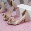 Adorable little girl wearing Newness Enchanted Garden Girls Block Heels showcasing the charming design and comfortable block heel