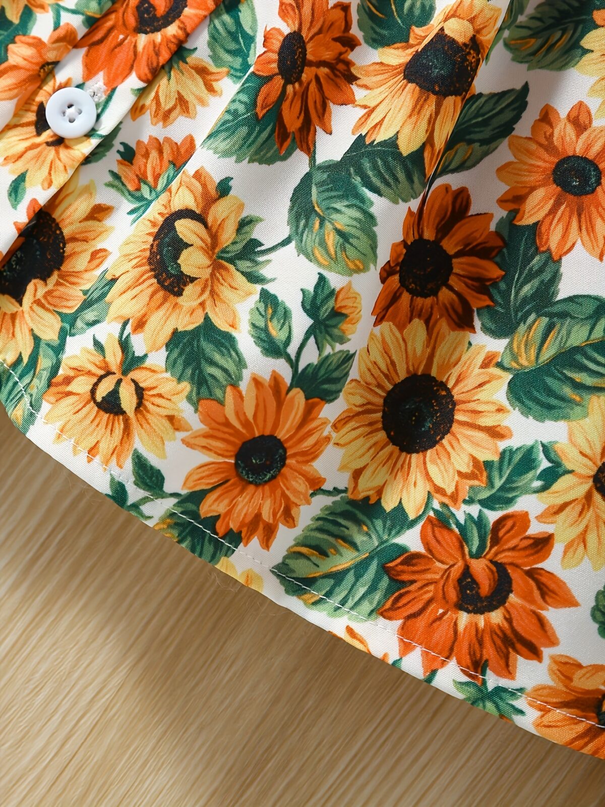 Baby girl wearing an adorable sunflower floral print dress perfect for summer