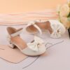 Adorable girls Pearl  Bow Mary Janes in white perfect for weddings parties and special occasions Featuring delicate pearls and charming bows