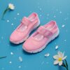 Adorable toddler wearing Newnesss Summer Breeze Sneakers running playfully outdoors on a sunny day