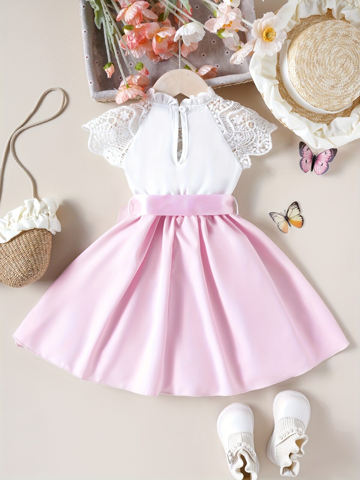 Adorable girl wearing a white Summer Bloom Lace Trim Dress showcasing its delicate lace details and summery style