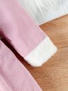 Adorable baby girl wearing a cozy corduroy dress set in fall colors perfect for autumn and winter The outfit includes a dress and matching pants