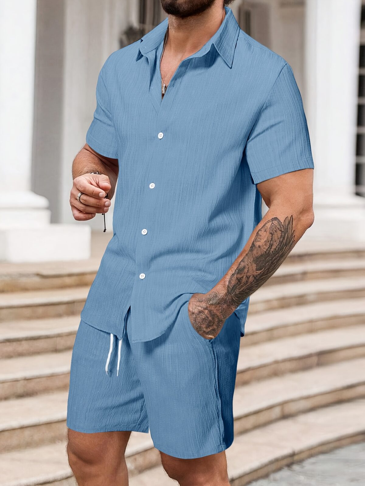 The Newness Riviera Escape Mens Summer Set A stylish and comfortable two piece outfit perfect for summer The model is wearing a crisp white shirt and coordinating shorts