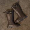 Stylish and warm girls fleece lined bow snow boots perfect for winter adventures The boots are shown from an angle showcasing the fleece lining the bow detail and the durable sole