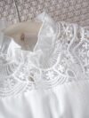 Adorable girl wearing a white Summer Bloom Lace Trim Dress showcasing its delicate lace details and summery style