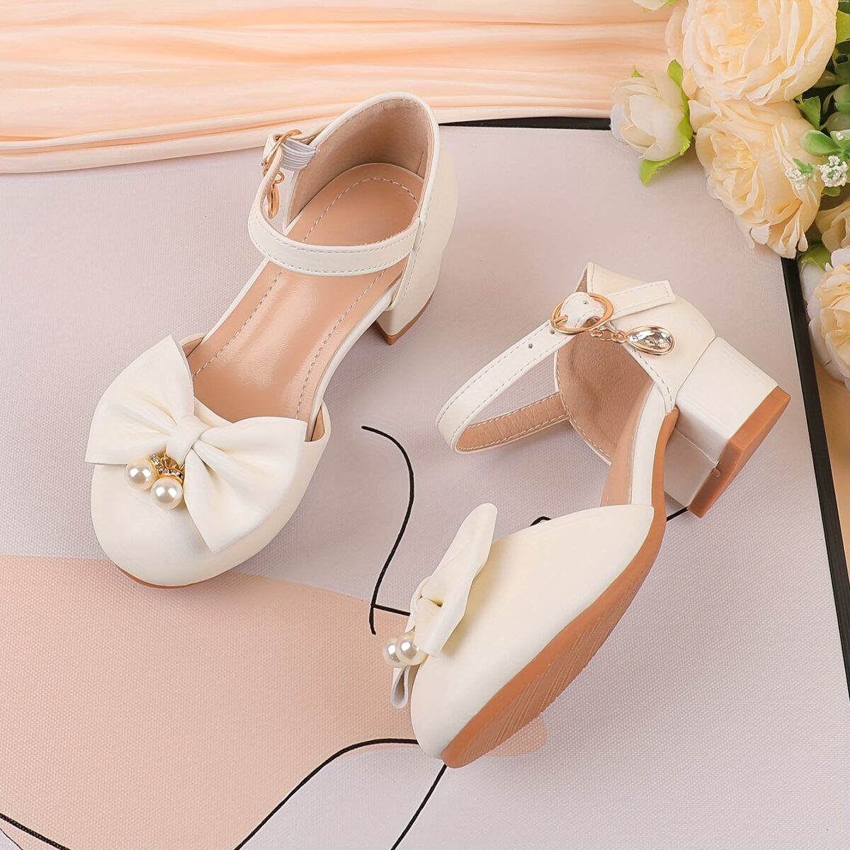 Adorable girls Pearl  Bow Mary Janes in white perfect for weddings parties and special occasions Featuring delicate pearls and charming bows