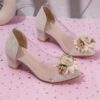 Adorable little girl wearing Newness Enchanted Garden Girls Block Heels showcasing the charming design and comfortable block heel