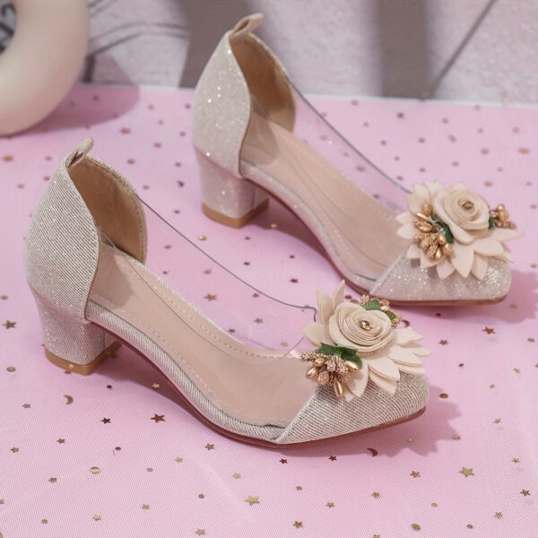 Adorable little girl wearing Newness Enchanted Garden Girls Block Heels showcasing the charming design and comfortable block heel