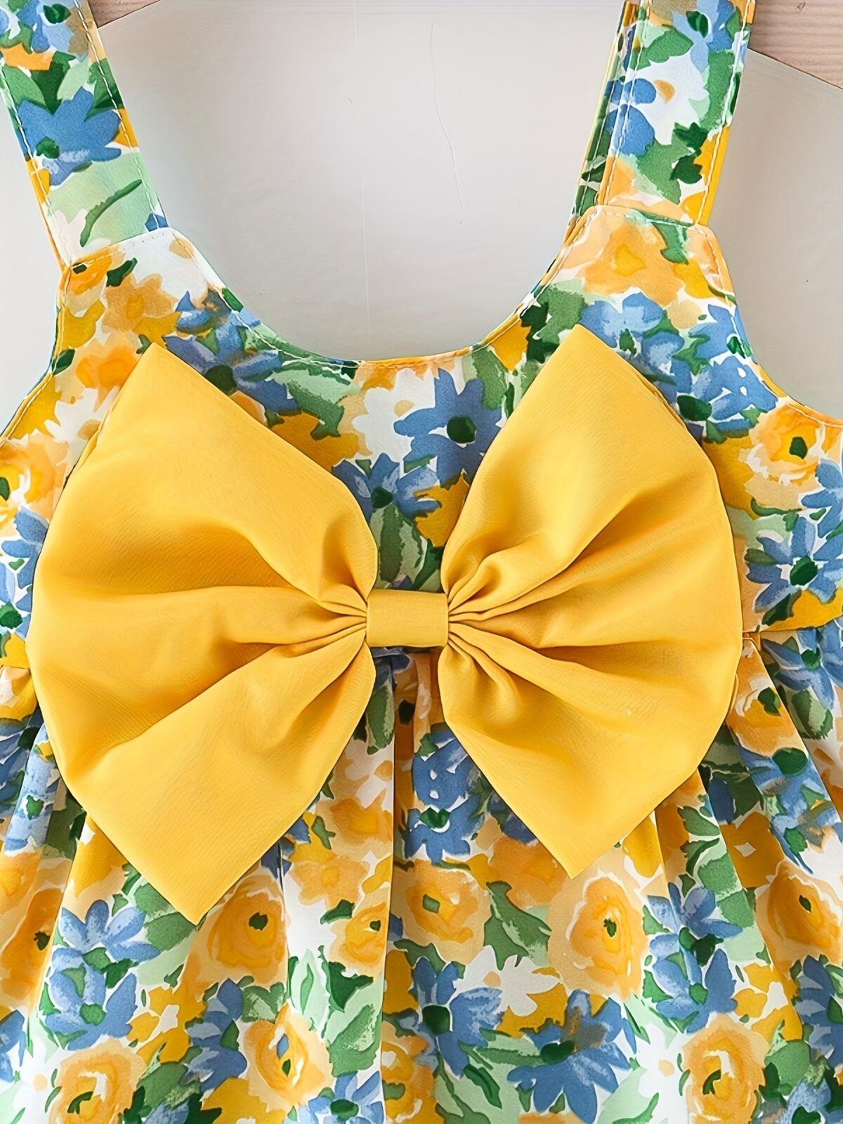Baby girl wearing adorable Newness floral print dress and hat set perfect for summer