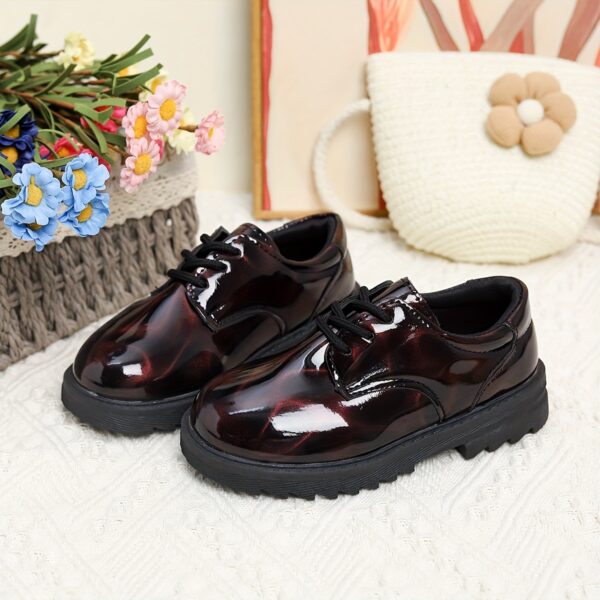 Adorable baby boy wearing stylish and comfortable Newness Little Gentleman shoes