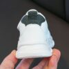Adorable kids Playful Striped Sneakers with a cute bear charm showcasing Newnesss stylish and comfortable design