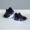 Glowing Cloud Kids Slip On Sneakers in action A childs feet wearing the stylish and comfortable Newness slip on sneakers ready for play The shoes are light colored and feature a unique design