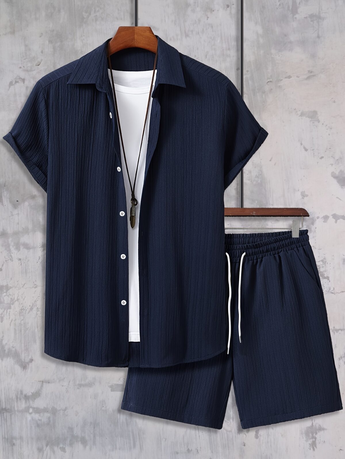 The Newness Riviera Escape Mens Summer Set A stylish and comfortable two piece outfit perfect for summer The model is wearing a crisp white shirt and coordinating shorts