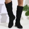 Newness Slouchy Suede Mid Calf Boots in rich brown suede leather showcasing the comfortable slouchy fit and mid calf height Perfect for adding a touch of effortless chic to any winter outfit
