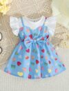 Adorable baby girl wearing a summer heart print dress perfect for school and special occasions