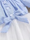 Adorable baby girl wearing a cute and playful summer stripe sundress perfect for playtime