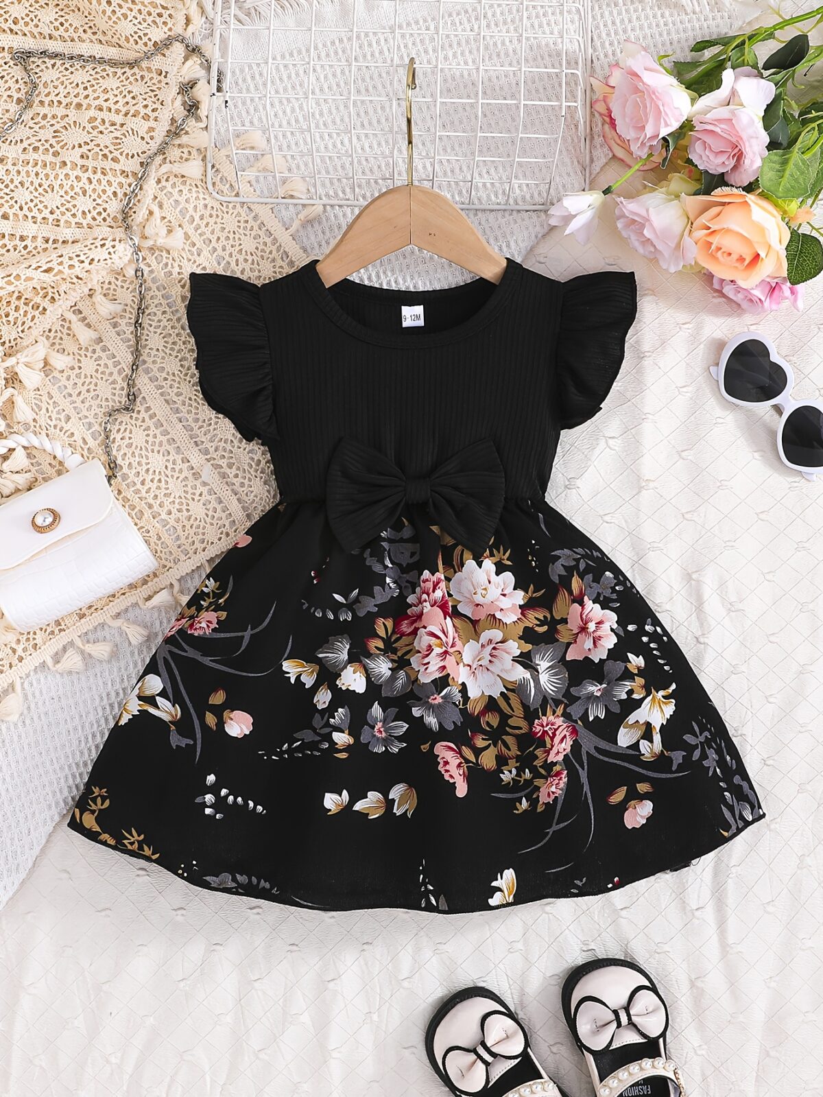 Adorable girl wearing a vibrant Summer Bloom floral print dress perfect for summer The dress features a playful colorful floral pattern