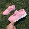 Adorable toddler wearing Newnesss Summer Breeze Sneakers running playfully outdoors on a sunny day
