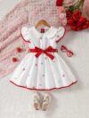 Sweet Cherry Print Dress with Bow from Newness A charming cherry printed dress with a cute bow