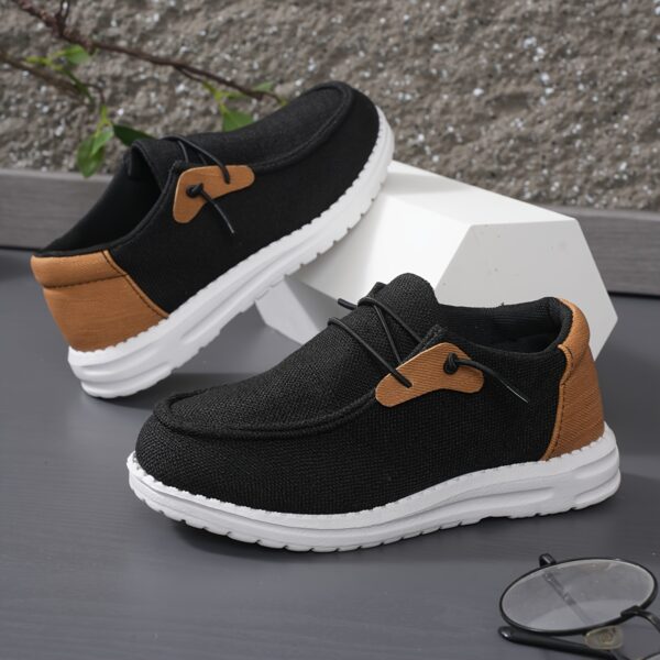 Stylish and comfortable blue canvas sneakers for boys perfect for playtime The shoes feature a classic design with durable construction