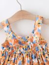 Baby girl wearing adorable Newness floral print dress and hat set perfect for summer
