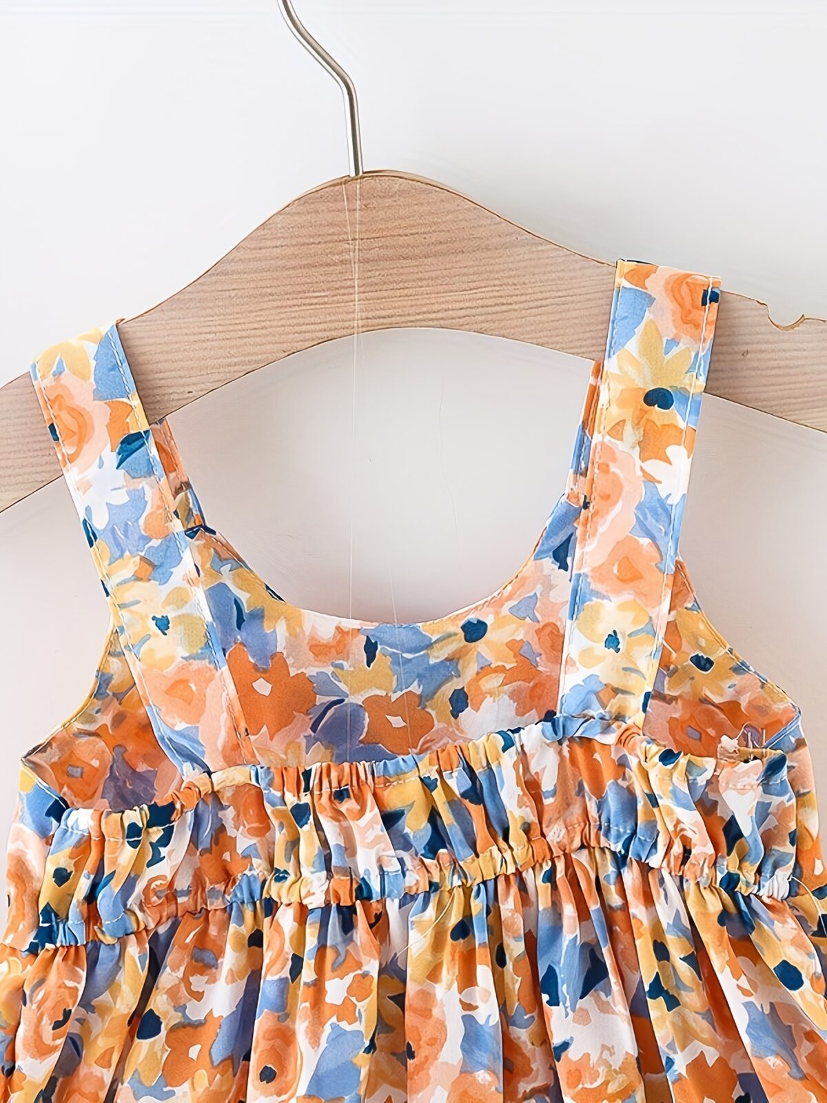 Baby girl wearing adorable Newness floral print dress and hat set perfect for summer