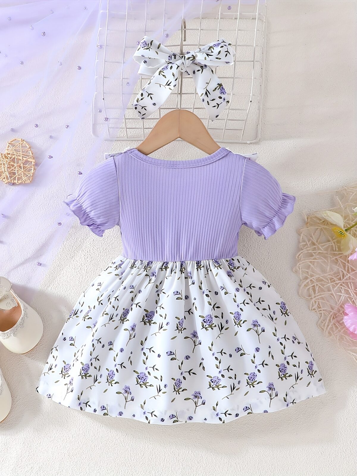 Adorable baby girl wearing a lightweight Summer Meadow floral print dress perfect for casual summer outings