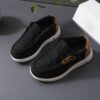 Stylish and comfortable blue canvas sneakers for boys perfect for playtime The shoes feature a classic design with durable construction