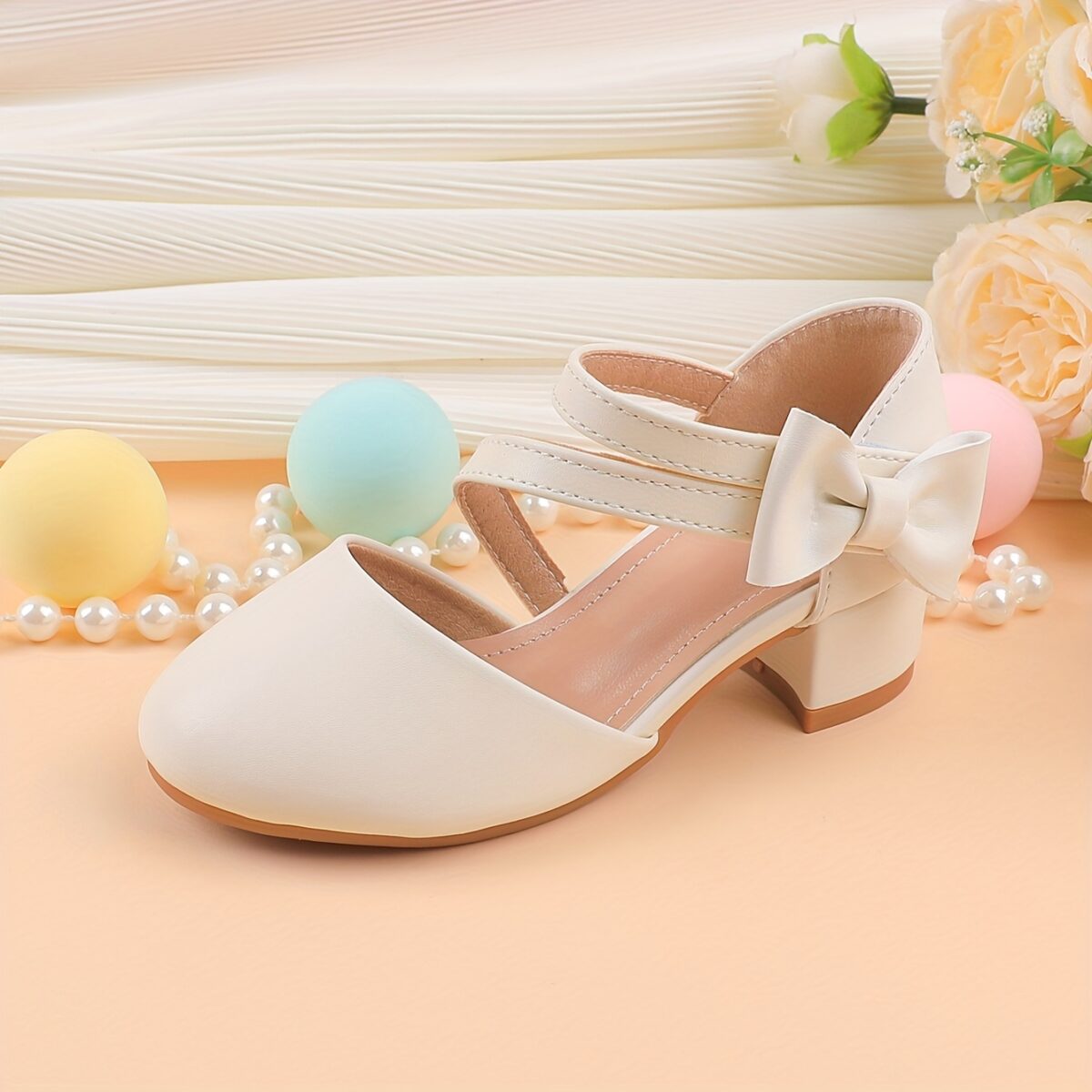 Adorable girls Mary Jane shoes with a delicate bow detail perfect for weddings parties and special occasions