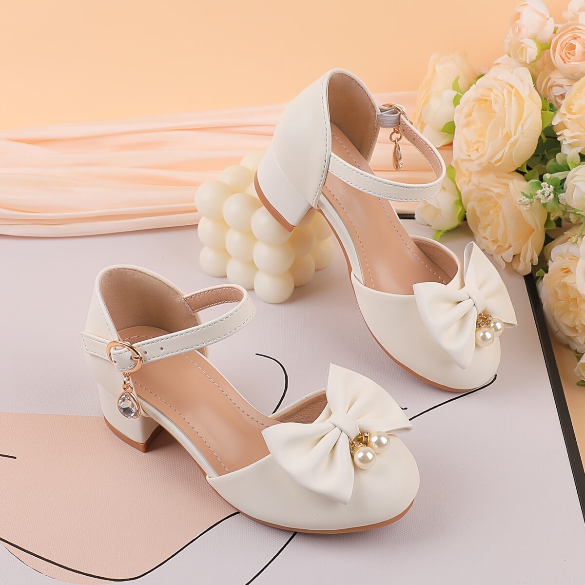 Adorable girls Pearl  Bow Mary Janes in white perfect for weddings parties and special occasions Featuring delicate pearls and charming bows
