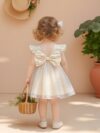 Adorable baby girl wearing a celestial themed tulle dress perfect for parties and special occasions