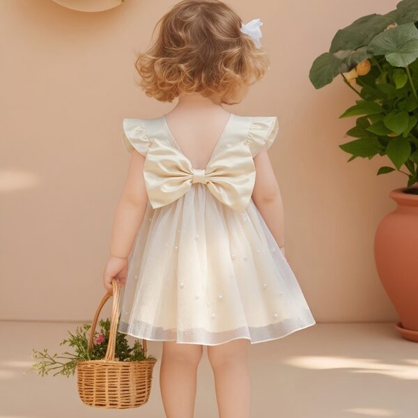 Adorable baby girl wearing a celestial themed tulle dress perfect for parties and special occasions