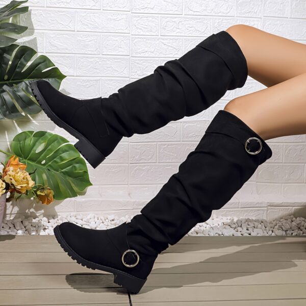 Newness Slouchy Knee High Boots in brown leather showcasing a chic and casual style perfect for winter The boots are slouchy and knee high highlighting their comfortable and fashionable design