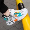 Stylish and comfortable Velocity Boys sports shoes in blue perfect for any occasion The shoes are shown from the side highlighting their design and comfort features
